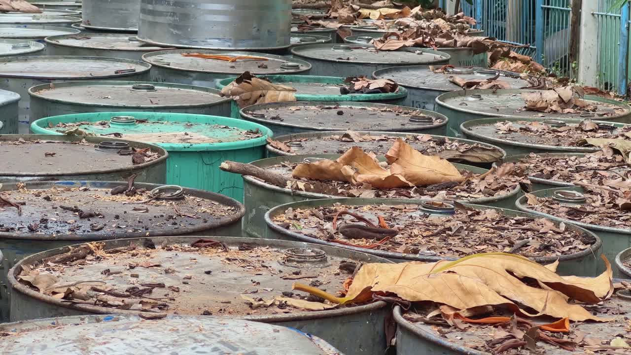 Rusty and Old Drums with Leaves