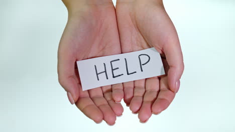 hands with the inscription help me on a white background