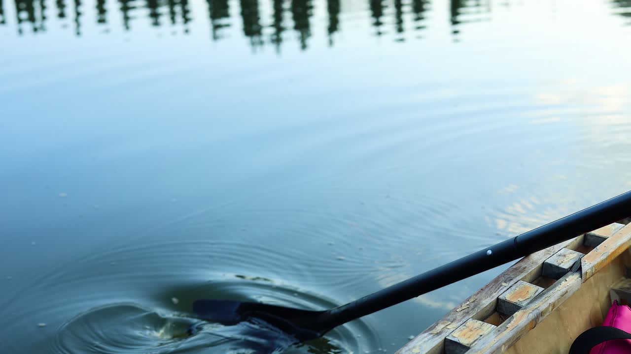 Sequence of kayak paddle moving through water