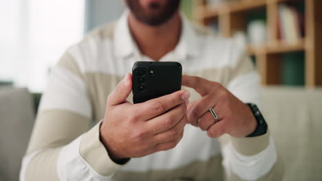 man using a smartphone indoors