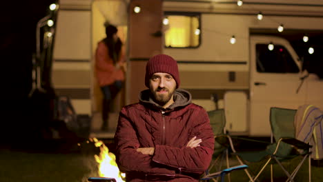 Portrait-of-bearded-young-man-sitting-on-a-chair-looking-at-the-camera