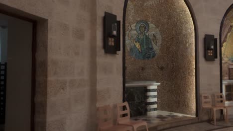 interior of a small chapel with mosaic artwork