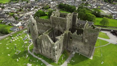 Aerial-drone-shot-of-castle-and-grassy-landscapes-in-Ireland