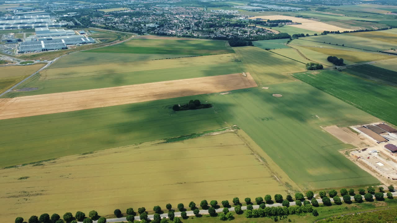 Aerial View of Rural Landscape with Fields, Town, and Industrial Area