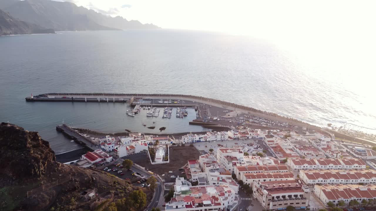 Aerial View of Coastal Town with Harbor and Boats