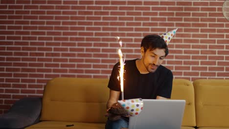 man celebrating distant birthday online with friends videochat conference laptop