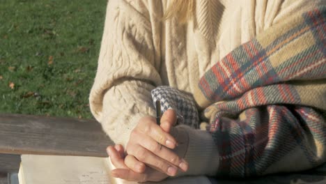 woman journalling outdoors focused tilt up