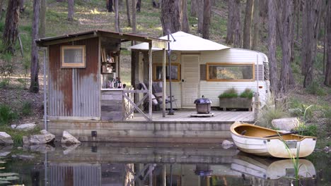 romantic and rustic cabin on a lake with a rowing boat, the perfect couples getaway