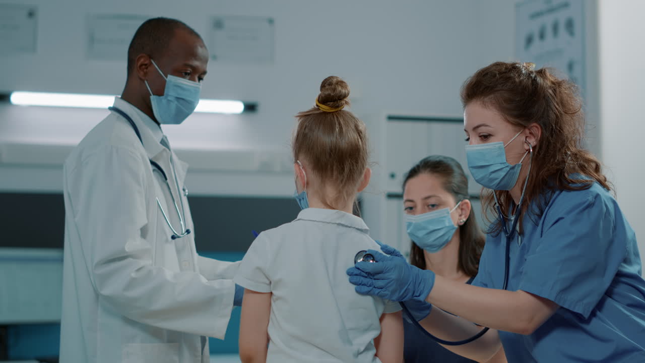 Medical professionals examining a child patient