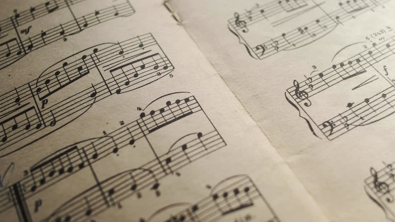 camera moves above a notebook with notes, close up, macro view, slider moving