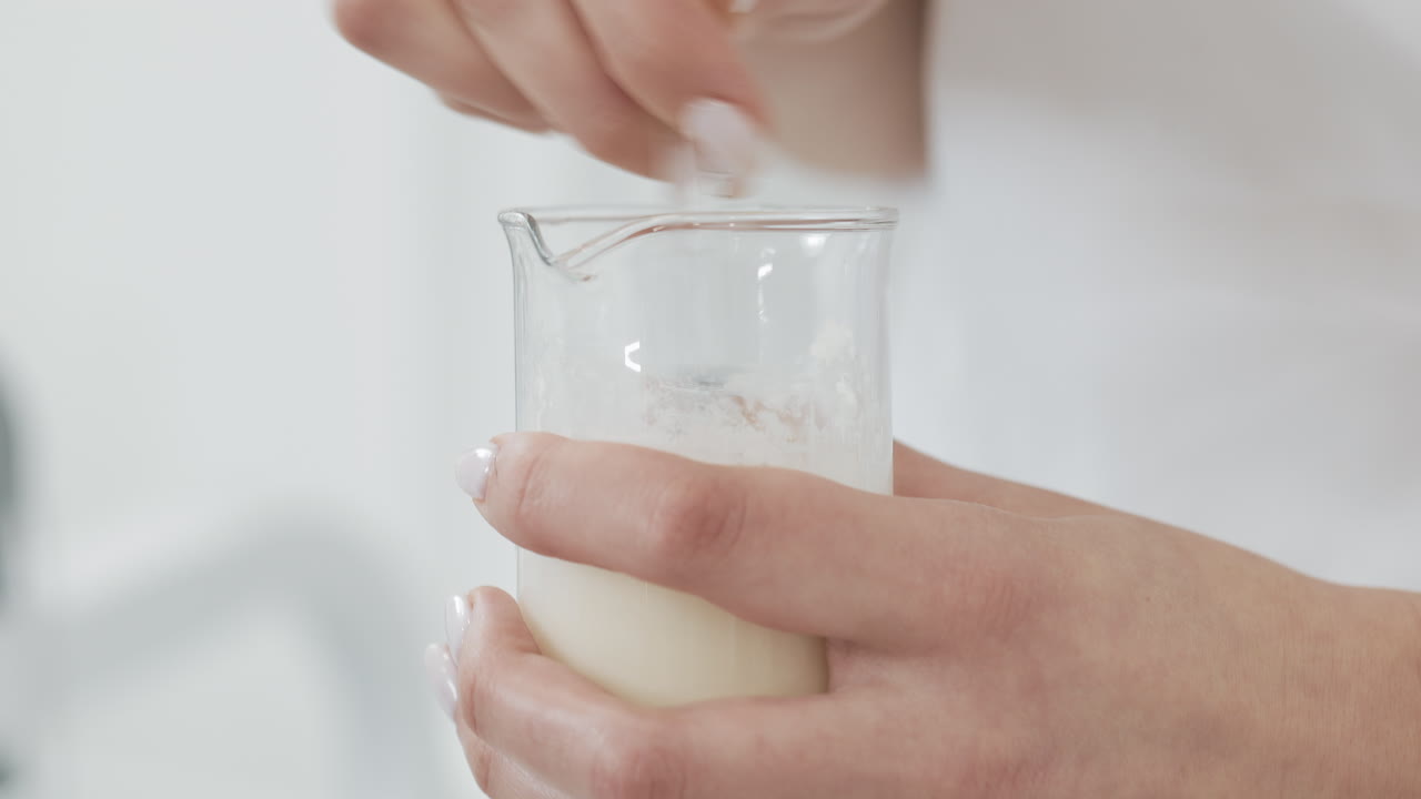 Mixing a white liquid in a beaker