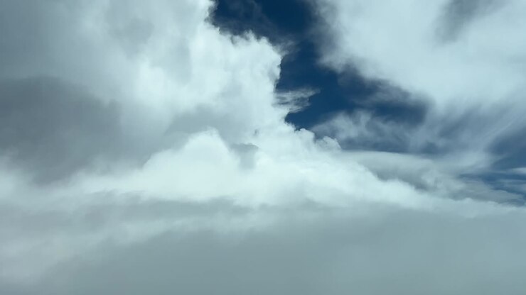 Aerial view of a cloudy sky looking for a gap to pass