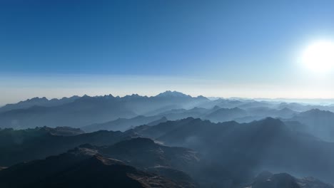 Flying-view-of-the-mountains-at-sunrise,-near-La-Veronica-mountain,-Sacred-Valley,-Cusco