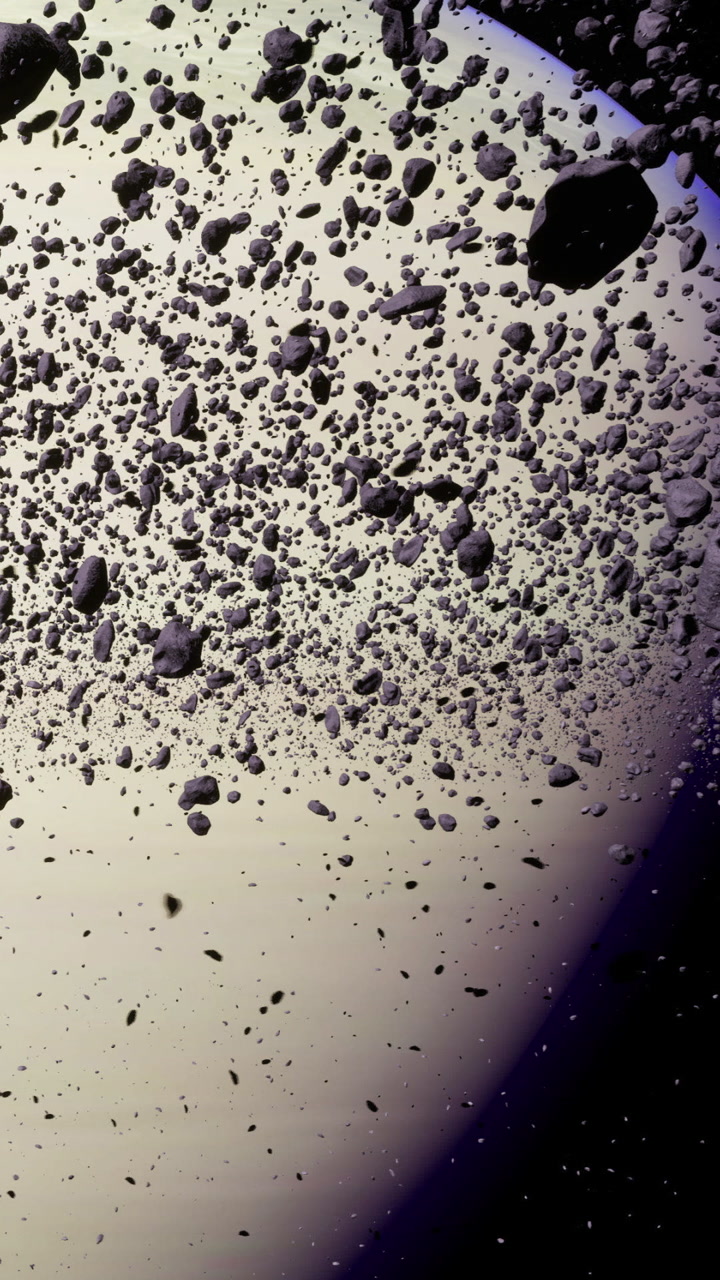 Floating rocks and debris swirling around a distant planet in deep space