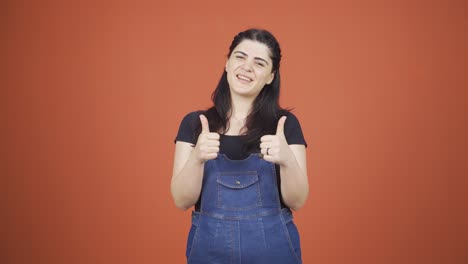 Woman-making-positive-gesture-at-camera.