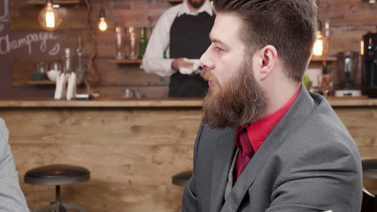Men talking at a bar