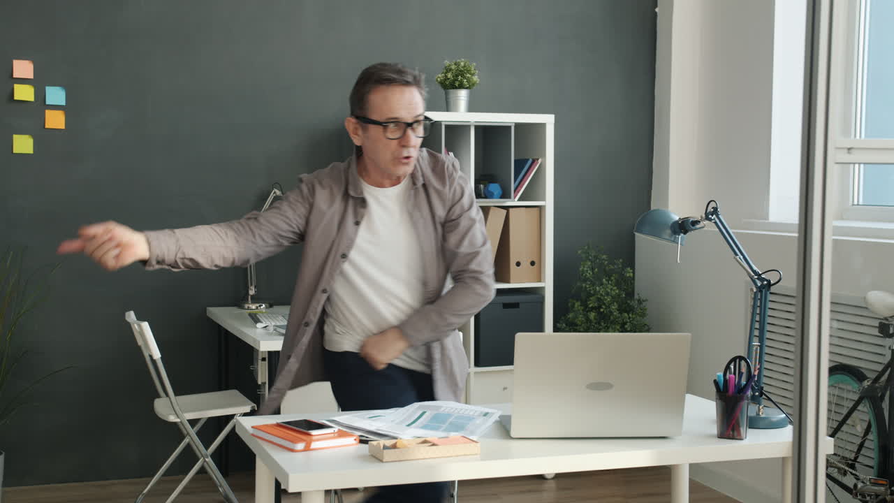 Man Dancing in Office