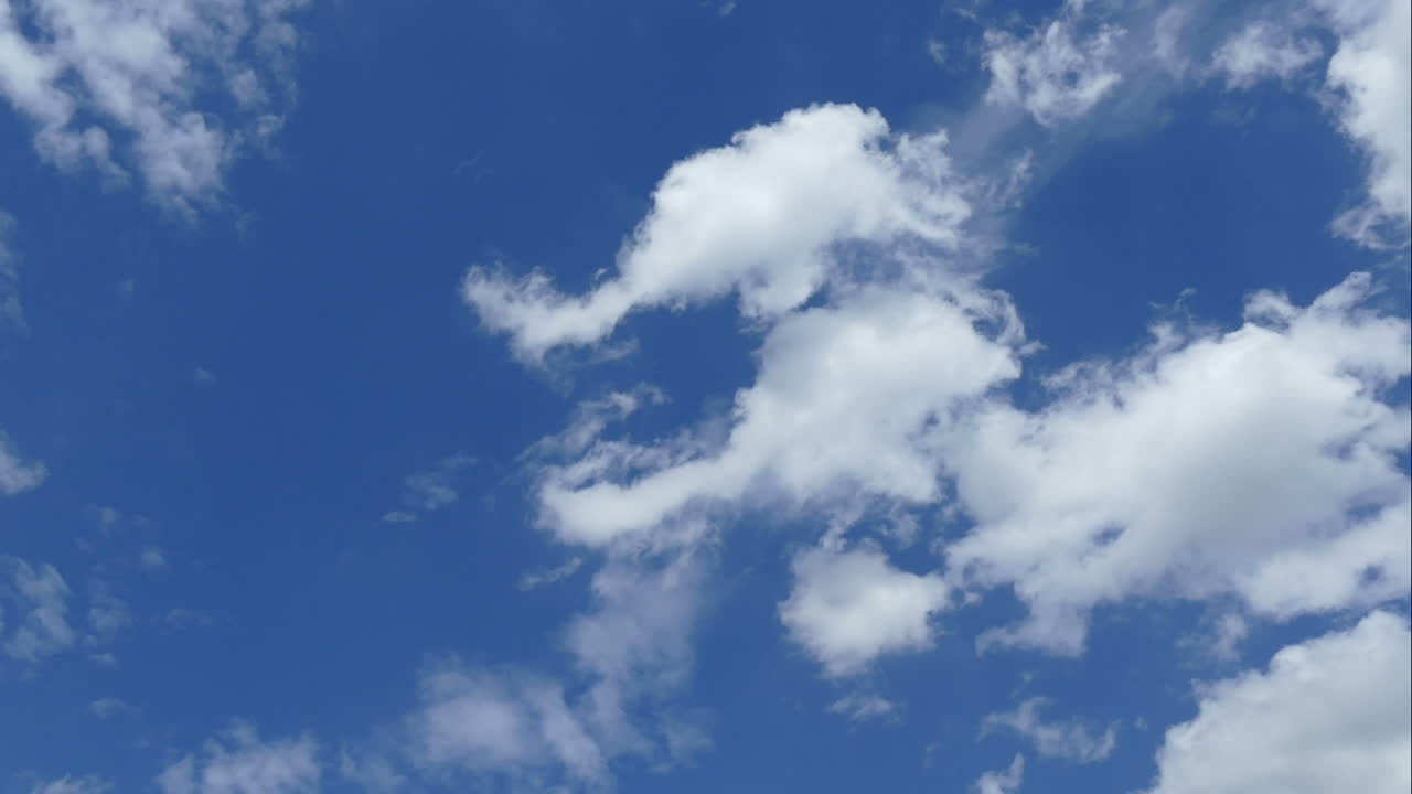 Timelapse rolling clouds on blue sky