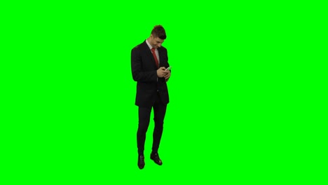 Businessman-in-suit-using-mobile-phone