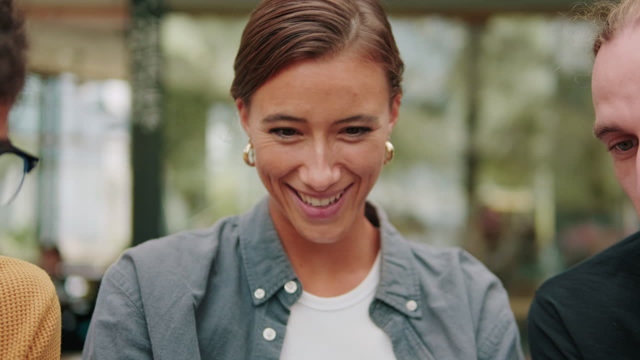 Male and female students using modern technology, lookin into laptop screen