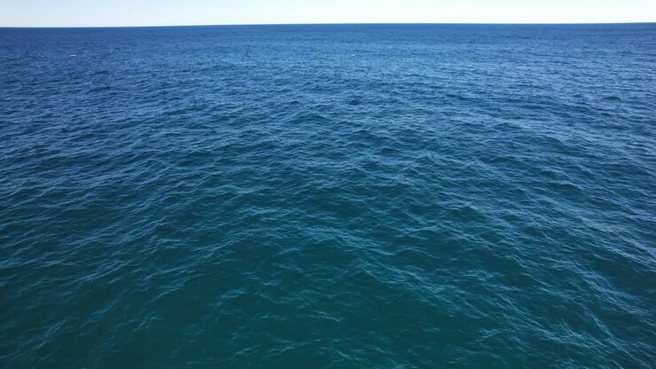 Aerial View Of Blue Ocean With Calm Waves