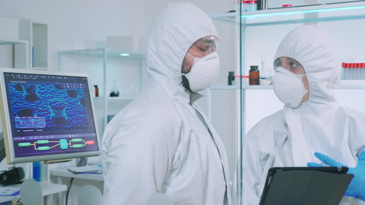 백신 개발에 대해 논의하는 코버럴을 입은 과학자 팀