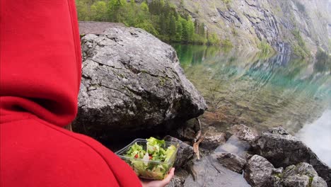 enjoying a salad by the lake