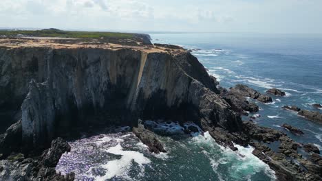 dramatic aerial view of a rugged coastline