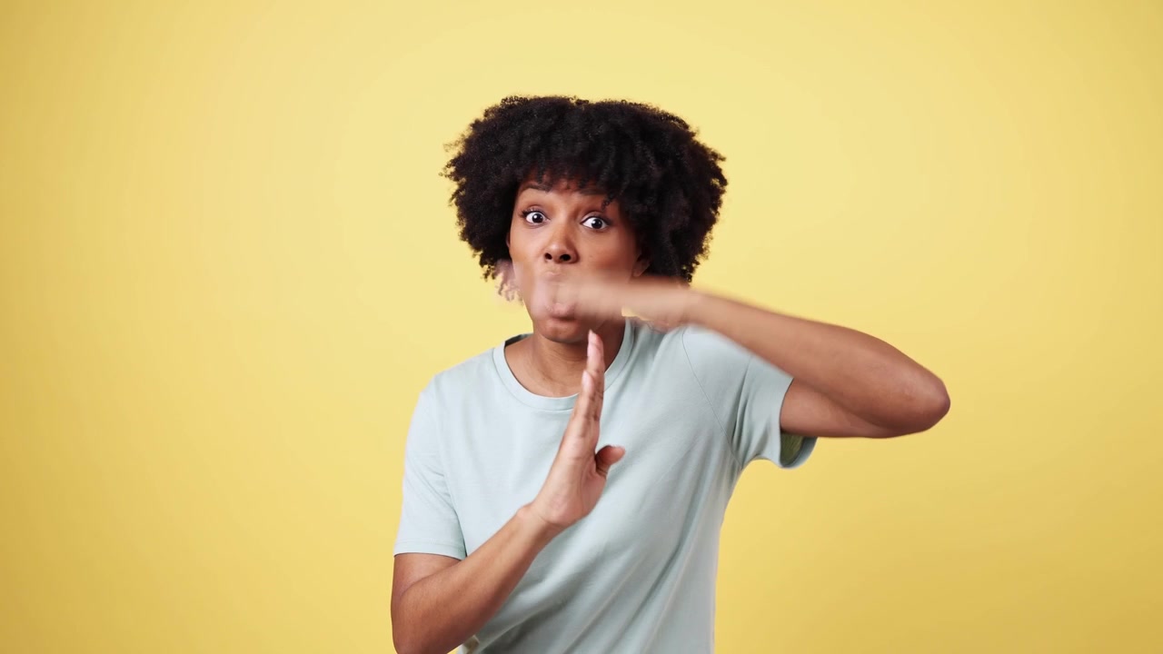 Young African American Woman Gesturing Time Out and Shush