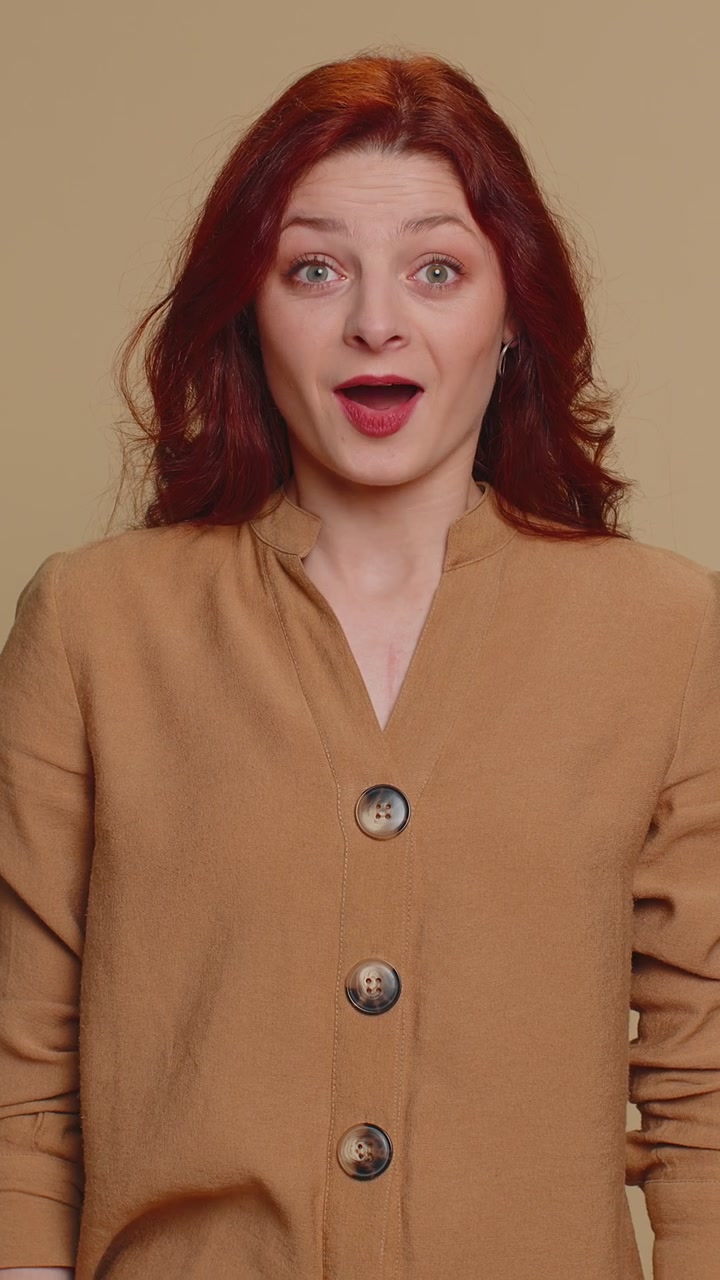 Excited amazed woman surprise looking at camera with big eyes shocked by sudden victory wow emotion