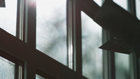 dollar bill hanging from window