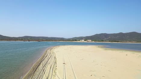 Drone-clip-flying-close-to-the-ground-over-a-tropical-beach-in-Greece