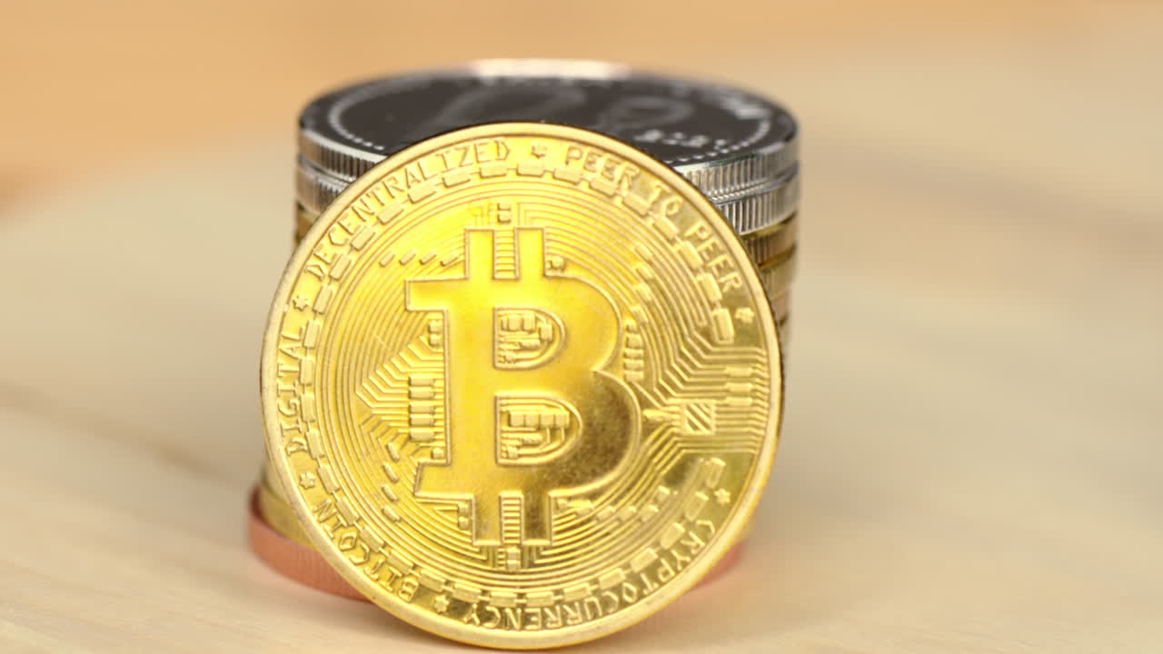 Golden and silver bitcoin crypto money with old dollar coins, close up, graphic video card mining