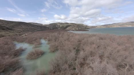 Aerial-fpv-drone-shot-over-lake-banks