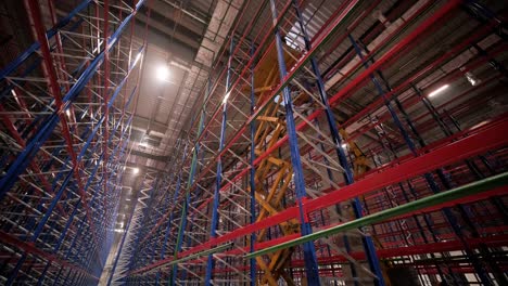 big and modern warehouse under construction, featuring metal shelving and other industrial equipment.