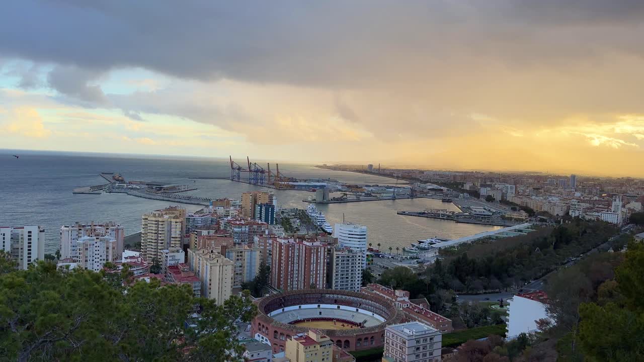 Malaga city view from above viewpoint bullring and marina cargo port Spain