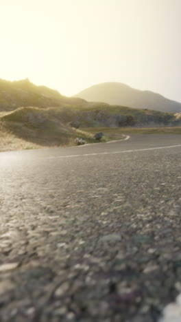 empty road leading up a mountain