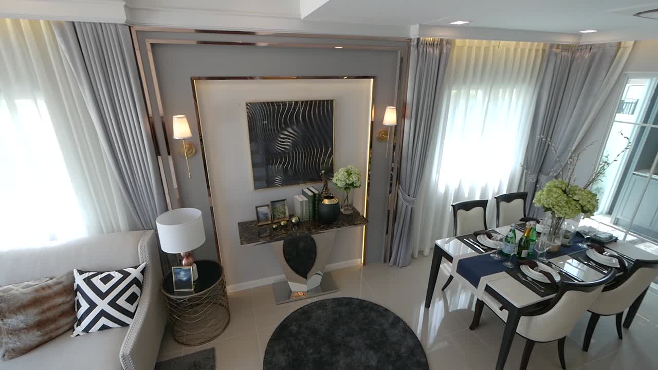 elegante recorrido de decoración del hogar de planta abierta desde la sala de estar hasta el comedor