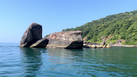 turtle shaped rock in ocean at goa india 4k