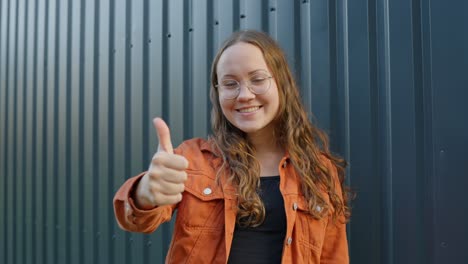 woman showing thumbs up for showing her approval, static