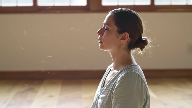 A Serene Moment of Meditation: Capturing the Tranquility and Inner Peace of a Young Woman in Repose, Reflecting in a Calm and Peaceful Environment
