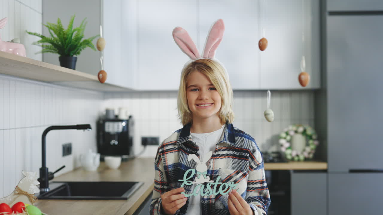 Happy Child with Easter Decorations in Kitchen