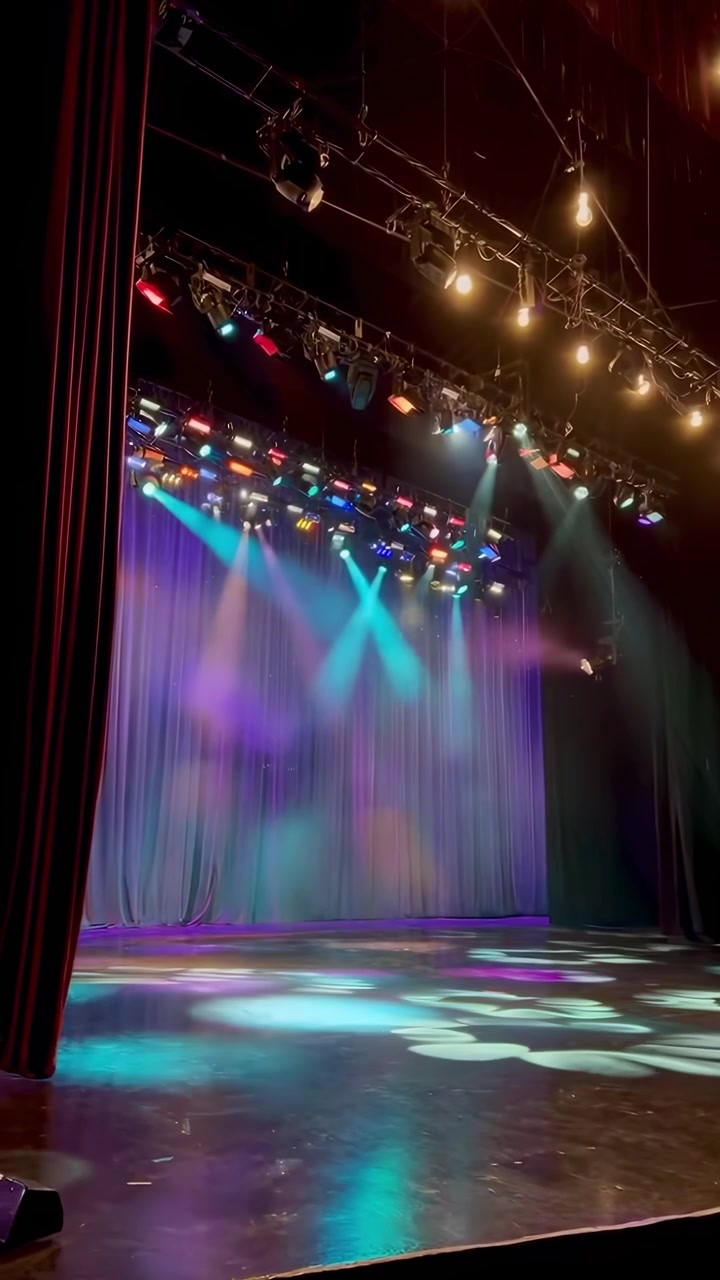 Empty Stage with Colorful Spotlight Beams and Haze