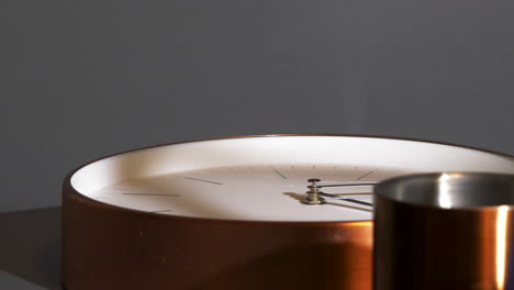 time passing on timepiece on table, shadows moving