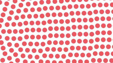 coral dots rotating towards left on white background offset left