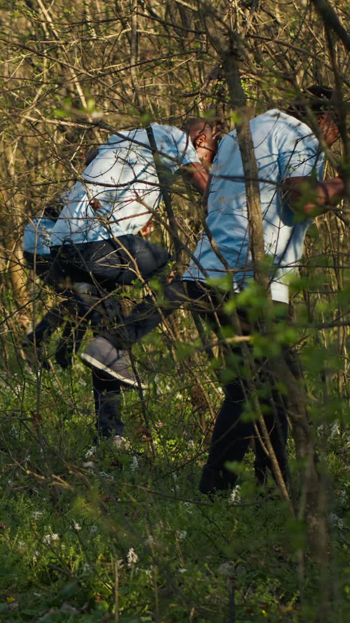 Young Volunteers Cleaning Up a Natural Area