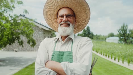 smiling senior farmer in his garden