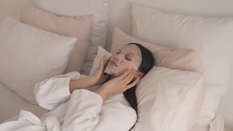 A-Pretty-Girl-Puts-On-A-Facial-Beauty-Mask