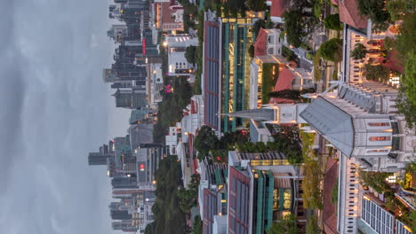 vertical day to night timelapse of singapore's river valley neighborhood