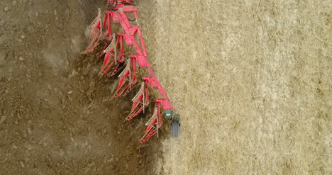 Close-Up-Of-Agricultural-Machinery-Plowing-Agricultural-Farmland-